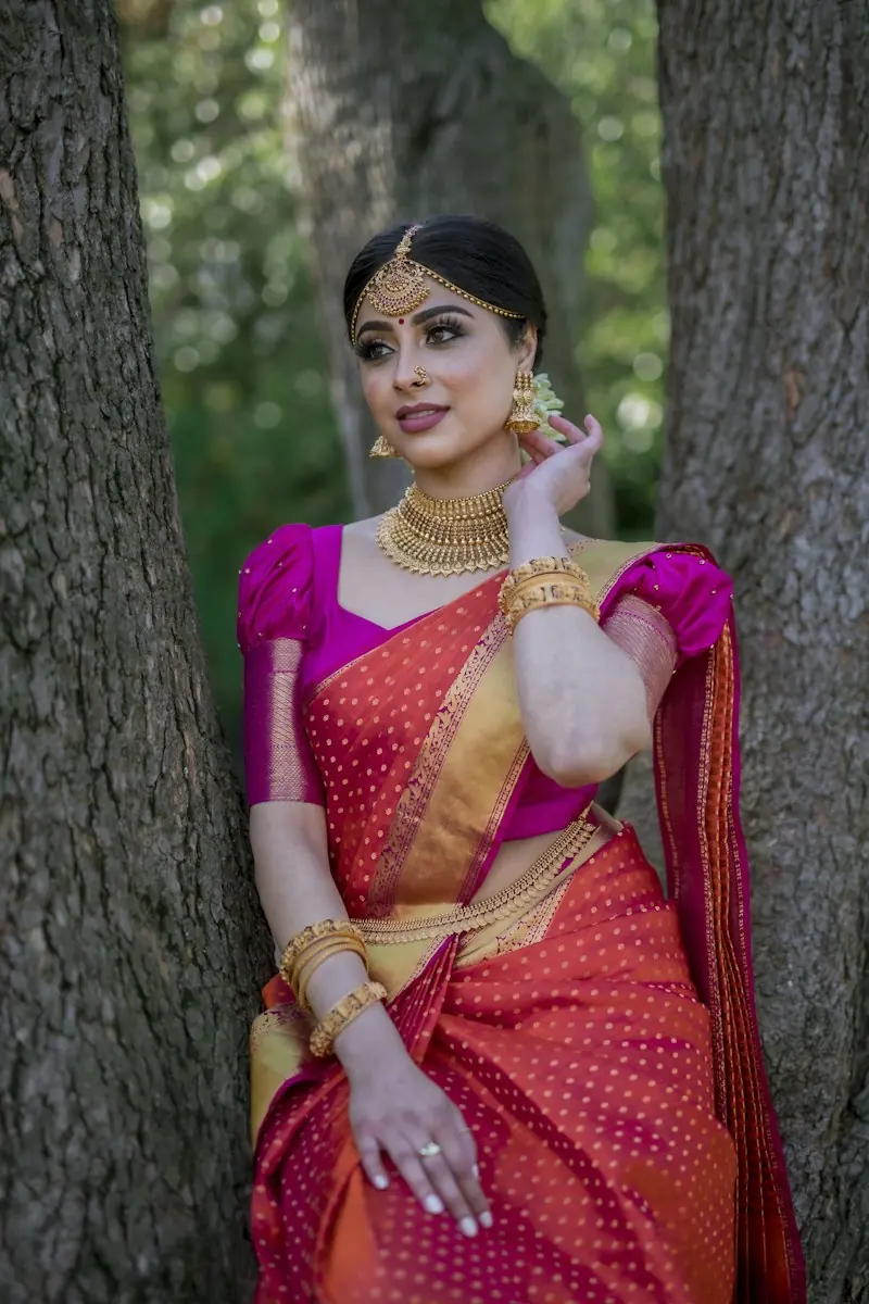 A bride dressed for her wedding morning in a silk saree